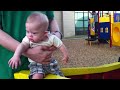 Down syndrome:&nbsp;Down Syndrome kid playing on a swing set