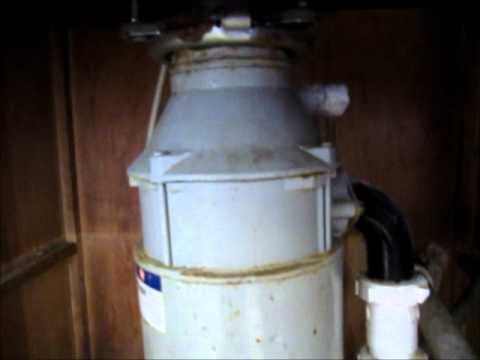 how to remove garbage disposal flange from sink