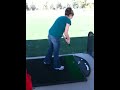Jennifer hitting golf balls for the first time