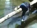guy crushes his balls on the log
