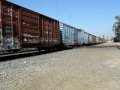 WB UPRR Manifest Train Crossing the BNSF Mainline @ Colton CA.AVI