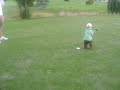 A very talented 16 month old baby playing golf