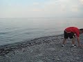 Nima skipping rocks.