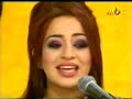 a beautiful arabic girl singing a traditional folk music