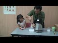 4 year old child making orange lolly with liquid nitrogen