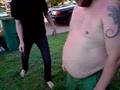 fat guy get kicked in the stomach and the balls