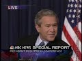 Bush talks into his tie Bush talks into his tie
