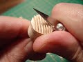 A photo essay of a miniature antique Singer sewing machine being carved and finished.