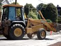 John Deere 310SE Backhoe Loading A Truck