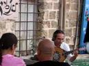 oud and violin player yair dalal plays for several guests in yaffa.
