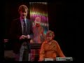 a slice of a typical thursday evening on bbc1, from 26 january 1984: the end of an edition of tomorrow's world (kieran prendiville presenting a demonstration of a sequencer run from a sinclair spectrum, band then plays out with their version of theme tune); trailer for saturday superstore (thompson twins); bbc1 globe; beginning of top of the pops presented by richard skinner and mike smith (first ever totp appearances by madonna and cyndi lauper later in the show, but not in this clip), and beginning of the alarm performing 'where were you hiding when the storm broke?'