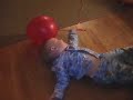 arilyn trying to sit on a balloon