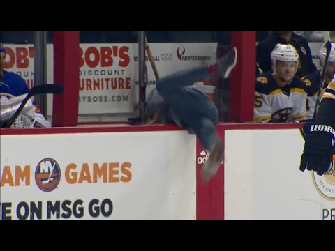 Video: Islanders' cameraman pulls a Donaldson, dives into bench