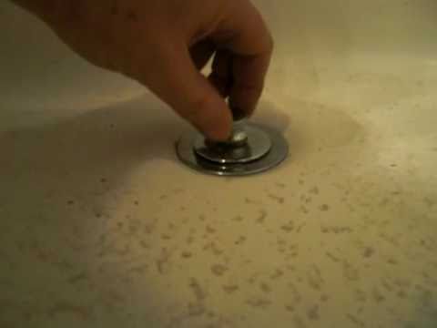 how to remove pop up drain in tub