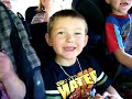We are driving in Auntie's van on the way to the beach - the kids are doing their best 