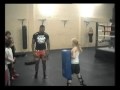 Little Girl Holding The Pads For Alistair Overeem