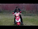Dad and Nicole ride around the yard on the little motorcycle until a sharp turn causes Radost to dash to the rescue!
