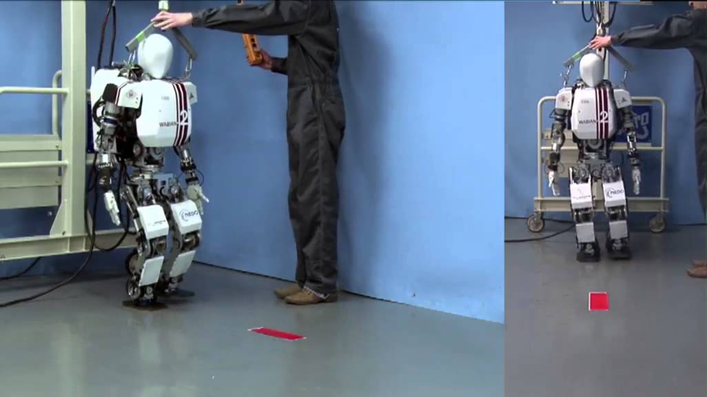 Humanoid robot WABIAN-2R walking with dynamically generated gait. The walking gait is dynamically generated using a hybrid gait pattern generator capable of rapid and dynamically consistent pattern regeneration.