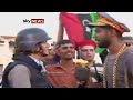news Gaddafi - Rebel Fighter Bags Gaddafi's Hat