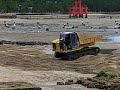 Redistributing sand on beach at Miyajima, Japan Part II Redistributing sand on beach at Miyajima, Japan Part II