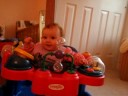 Aubery laughing in the exersaucer Aubery laughing in the exersaucer