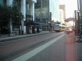 blue line train cruising through town