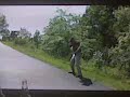 Phil Mickelson hitting it off a cart path