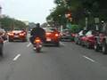Big big man on little little motorcyle