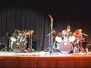 young men perform a drum duet they created. they won their school's talent show with this act.