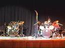 young men perform a drum duet they created. they won their school's talent show with this act.