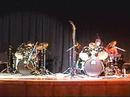 young men perform a drum duet they created. they won their school's talent show with this act.