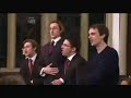 Nonsense! jack Straw is heckled by a barber shop quartet.