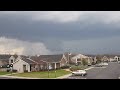 My wife filmed this while I was downstairs taking pictures. Notice what looks like a very small funnel pushing out at the top right of the wall cloud at 