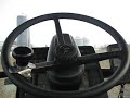 Video demonstrating an older model articulated tractor equipped with a 