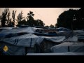 Six months after the earthquake that killed up to 300000 people, the dust is starting to settle over Port-au-Prince. As it does, the deep wounds that fracture this country are re-emerging, more gaping than even before.