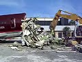 Trackhoe eats American Airlines 727 airplane