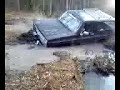 Truck stuck in mudhole winches out