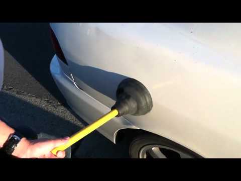 how to get a door dent out of car