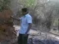 eddy,. tryin the padayappa's style of takin the snake from that pit,. that long stick in his hand is supposed to be the snake ,. lol,.!!
