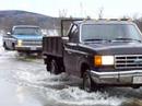 Two trucks cross rising wolastoq (good river)or St. John river.Before the arrival of the first Acadian settlers around 1784, the Upper St.John River valley was home to the Wolastoqewiak or Maliseet (Malécite) Nation, a branch of the Algonquin peoples. The Wolastoqewiak, is derived from the word wolastoq, which means 