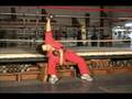 Sitting on a Bench Punching Up with Dumbells