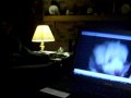 Havachon puppy watching self on computer listening to cockatiel talk on cell phone