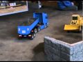 Hanomag C66 lädt Sattelkippmulde