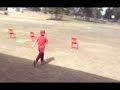 Caileb trying to jump over the chair like the other kids