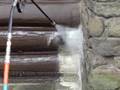 Pressure washing chemical stripping paint from log home