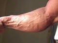 Bodybuilder Wong Hong poses forearms, bis