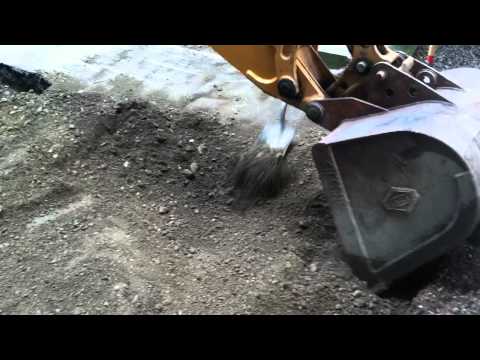 Case590 - spreading some gravel for the base for a new transformer.