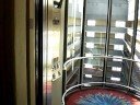 These elevators are famous for being some of the most thrilling in the world. This building, completed in 1985, was designed by Atlanta Architect John Portman, who designed the Westin Peachtree Plaza, SunTrust Plaza, Peachtree Center, Marriott Marquis New York, and America's Mart Atlanta. The Atrium runs the length of the building, and was the tallest (and by some conflicting accounts with the Luxor Hotel in Las Vegas, the largest) in the world until the Burj Al-Arab was completed in Dubai. There is nothing like going 5 m/s while flying by floor landings. This is really an impressive show of Otis's engineering, even by today's standards. They were some of the first elevators in the world to be installed with weight sensors, which would put an elevator in express mode if it were full (since it's dumb for it to stop for others just to start up again with the same amount of passengers). These were also some of the first with voice announcements, a feature introduced with the Elevonic 401 back in 1981. This building has recently undergone, along with the other Marriott Marquis in New York, many renovations. Nevertheless, this building's interior is still astounding, despite it being almost 25 years old. The interior, along with the elevators, is a true masterpiece.Building Information:http://www.emporis.com/en/wm/bu/?id=marriottmarquishotel-atlanta-ga-usahttp://skyscraperpage.com/cities/?buildingID=633http://en.wikipedia.org/wiki/Atlanta_Marriott_Marquishttp://www.rediscovermarquis.com/http://www.tripadvisor.com/Hotel_Review-g60898-d89377-Reviews-Marriott_Marquis_Atlanta-Atlanta_Georgia.htmlhttp://www.nfb.org/Images/nfb/Publications/bm/bm07/bm0704/bm070403.htmhttp://www.marriott.com/hotels/travel/atlmq-atlanta-marriott-marquis/Elevator Manufacture: Otis Elevator CompanyElevator Model: Otis Elevonic 401Capacity: 3500 lbs (1600 kg)Floors Served: ML, LL, Al, 10, 42-47Year Installed: 1985, modernized 2007-2008Distance Travelled: 160-165m (Building is 168m tall)Elevator Speed: 4-5 m/s (800-1000 FPM)