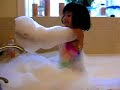 Sophie overflows the bathtub with Bubbles