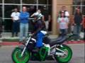 12 year old kid on street bike; wheelies!